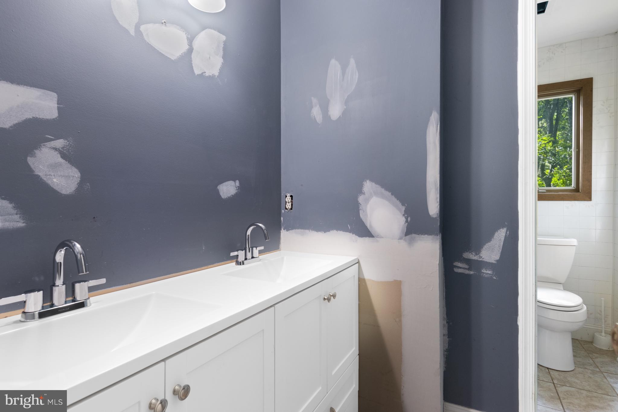 570 Chandler Mill Road Avondale, PA 19311 - Photo 27 of 41 a bathroom with a sink vanity and toilet