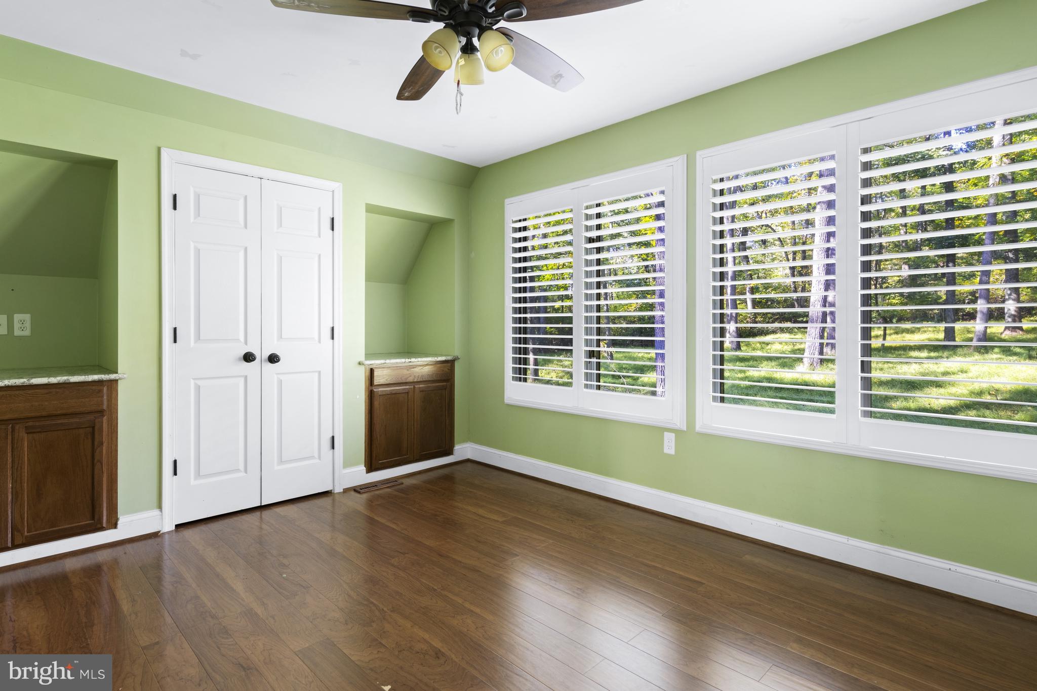 570 Chandler Mill Road Avondale, PA 19311 - Photo 29 of 41 a view of an empty room with a window and wooden floor