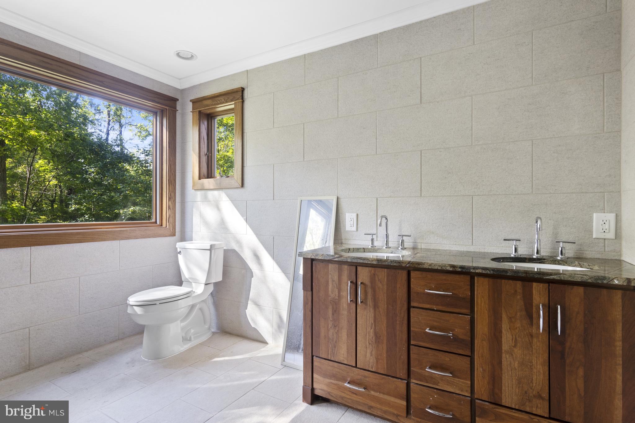 570 Chandler Mill Road Avondale, PA 19311 - Photo 32 of 41 a view of a kitchen with a sink wooden cabinets and entryway
