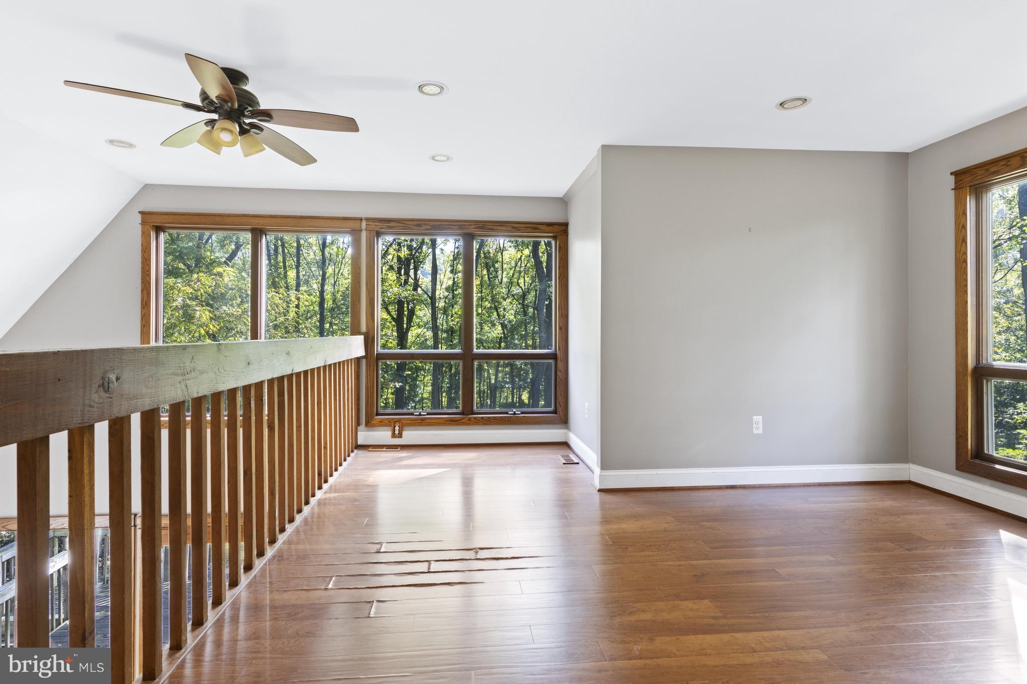 570 Chandler Mill Road Avondale, PA 19311 - Photo 34 of 41 a view of an empty room with wooden floor and a window