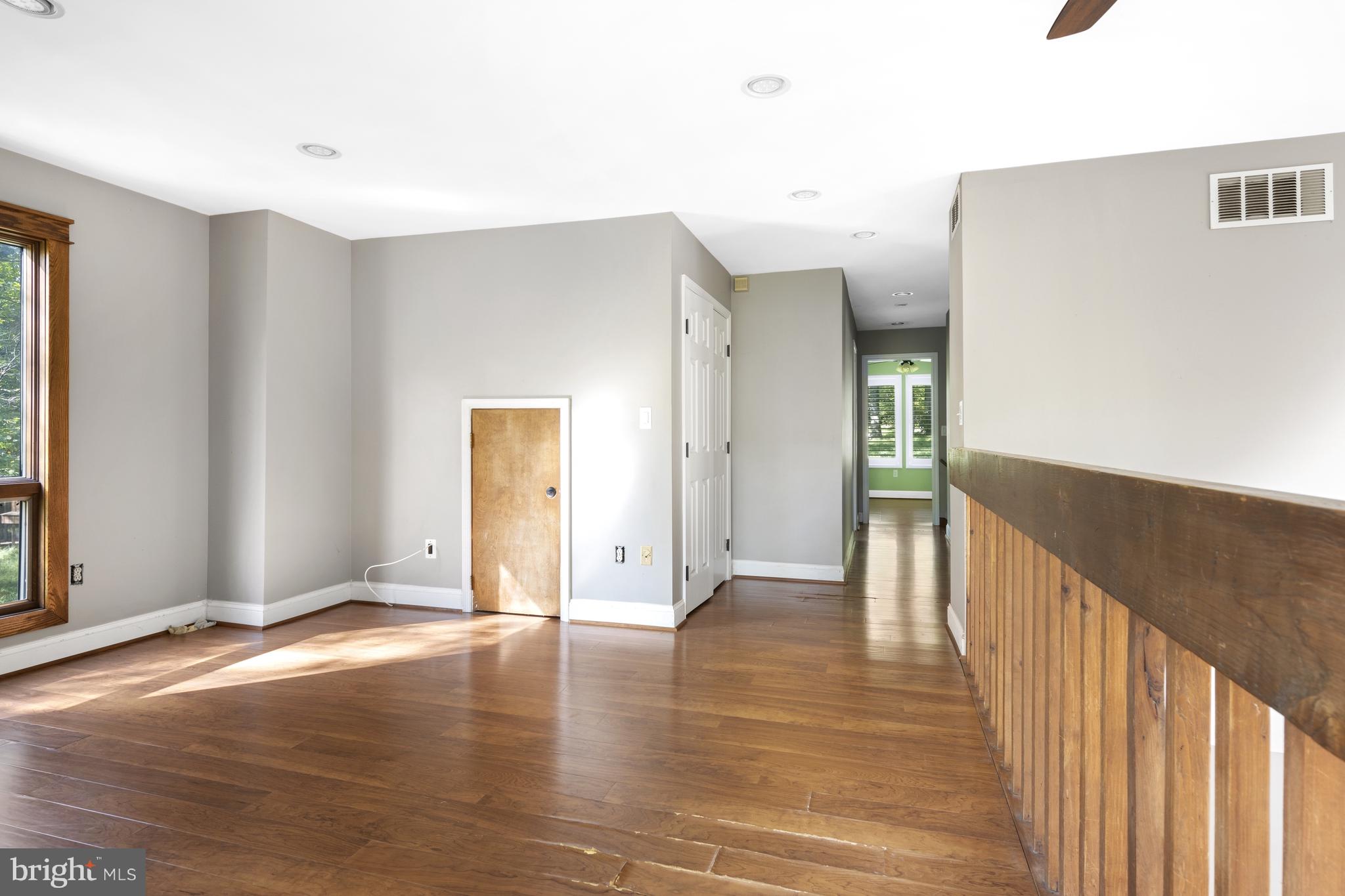 570 Chandler Mill Road Avondale, PA 19311 - Photo 36 of 41 a view of a hallway with wooden floor