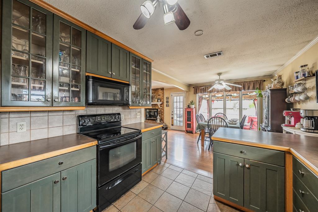 748 Regency Drive Hurst, TX 76054 - Photo 2 of 31 Abundant countertop space!