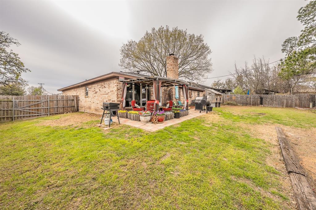 748 Regency Drive Hurst, TX 76054 - Photo 28 of 31 Plenty of room in this back yard.
