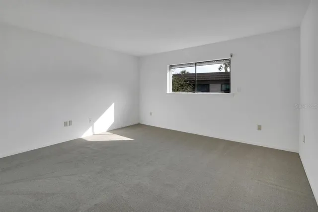 a view of a livingroom with an empty space and window