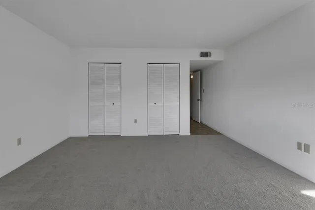 a bathroom with a shower and toilet