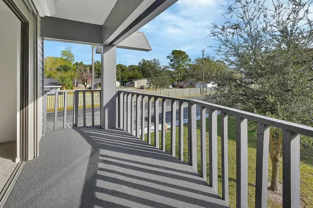 a view of a balcony with mountain view