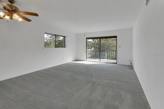 a view of an empty room with a window