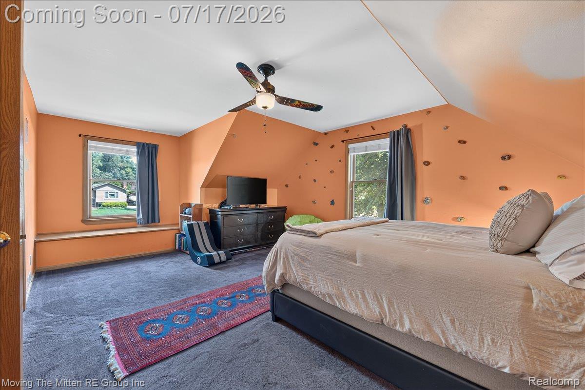 40162 Alden Road Belleville, MI 48111 - Photo 30 of 67 Carpeted room featuring sloped ceilings, a ceiling fan, and multiple windows