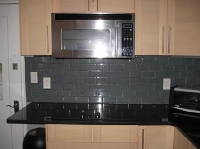 a bathroom with a sink and a granite counter top