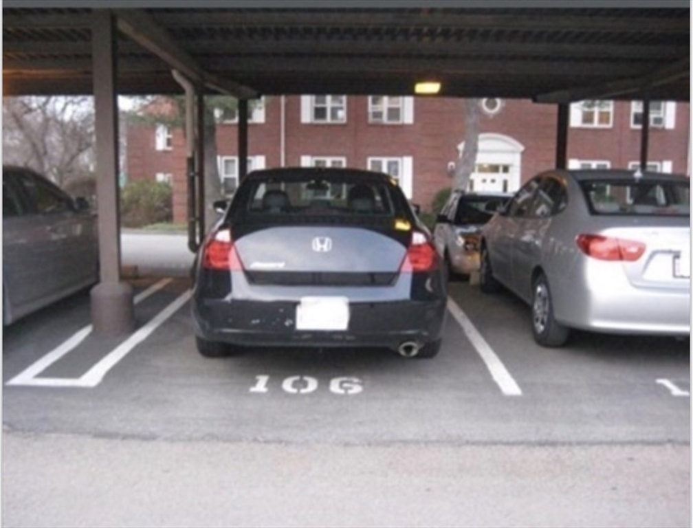 136 Boylston Street, Unit 1 Newton, MA 02467 - Photo 20 of 21 a view of parking garage with cars parked
