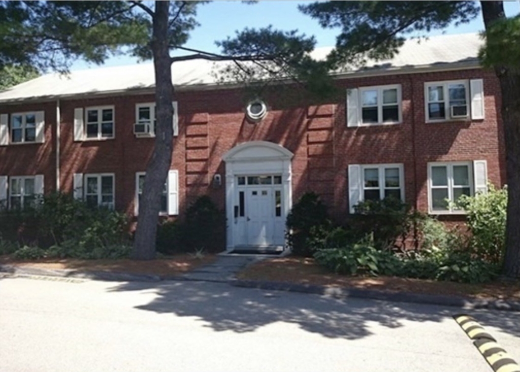 136 Boylston Street, Unit 1 Newton, MA 02467 - Photo 2 of 21 a front view of a house with a yard