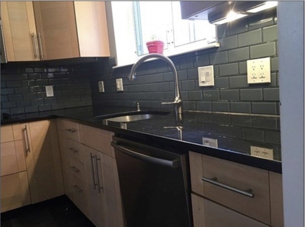 136 Boylston Street, Unit 1 Newton, MA 02467 - Photo 8 of 21 a kitchen with a sink and cabinets