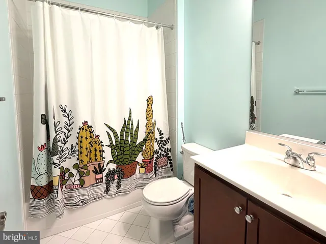 a bathroom with a sink a toilet and tub
