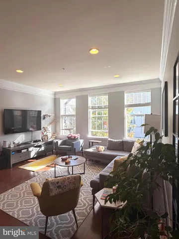 a living room with furniture fireplace and a flat screen tv