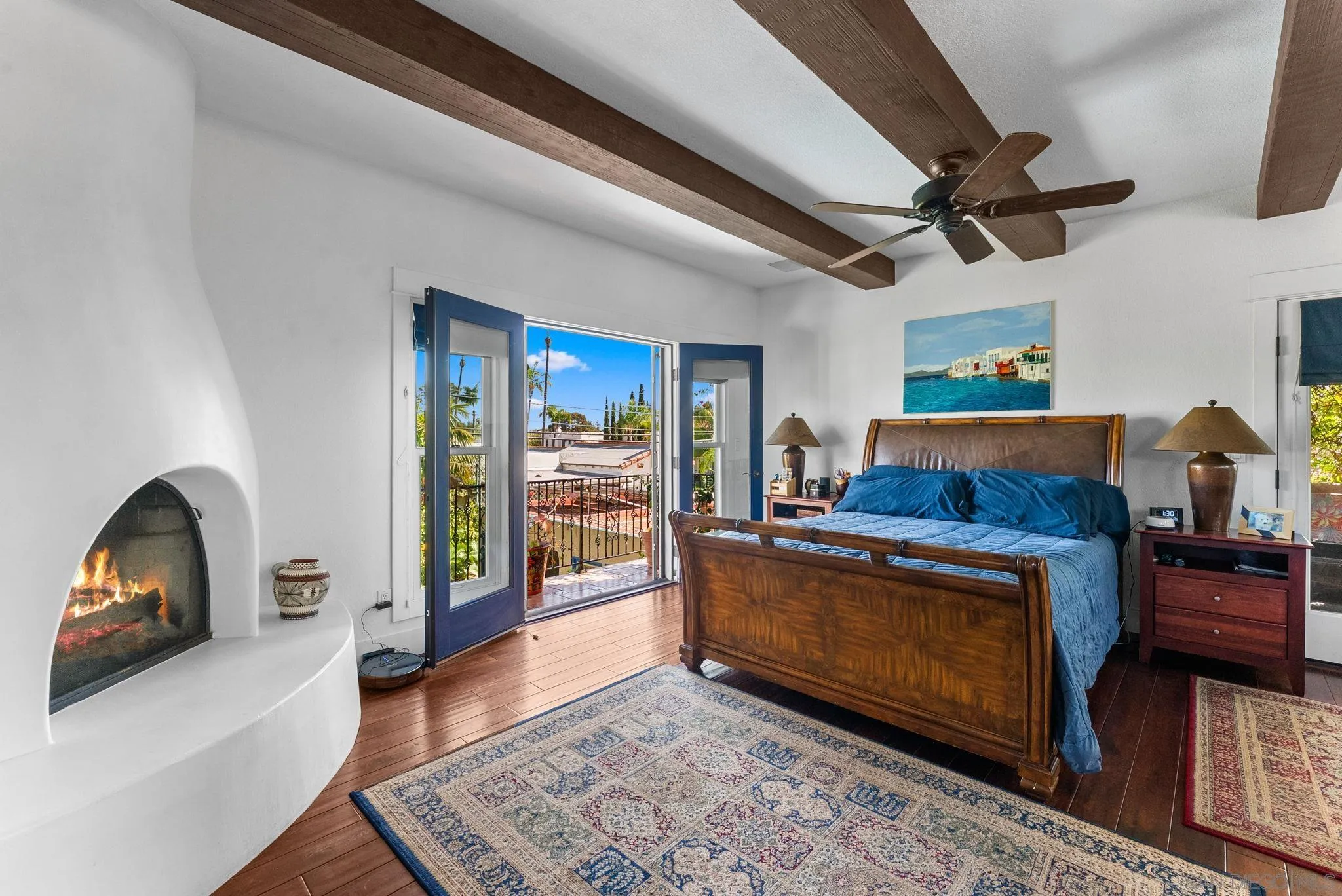 4965 Marlborough Drive San Diego, CA 92116 - Photo 15 of 47 a living room with a couch wooden floor and a fireplace