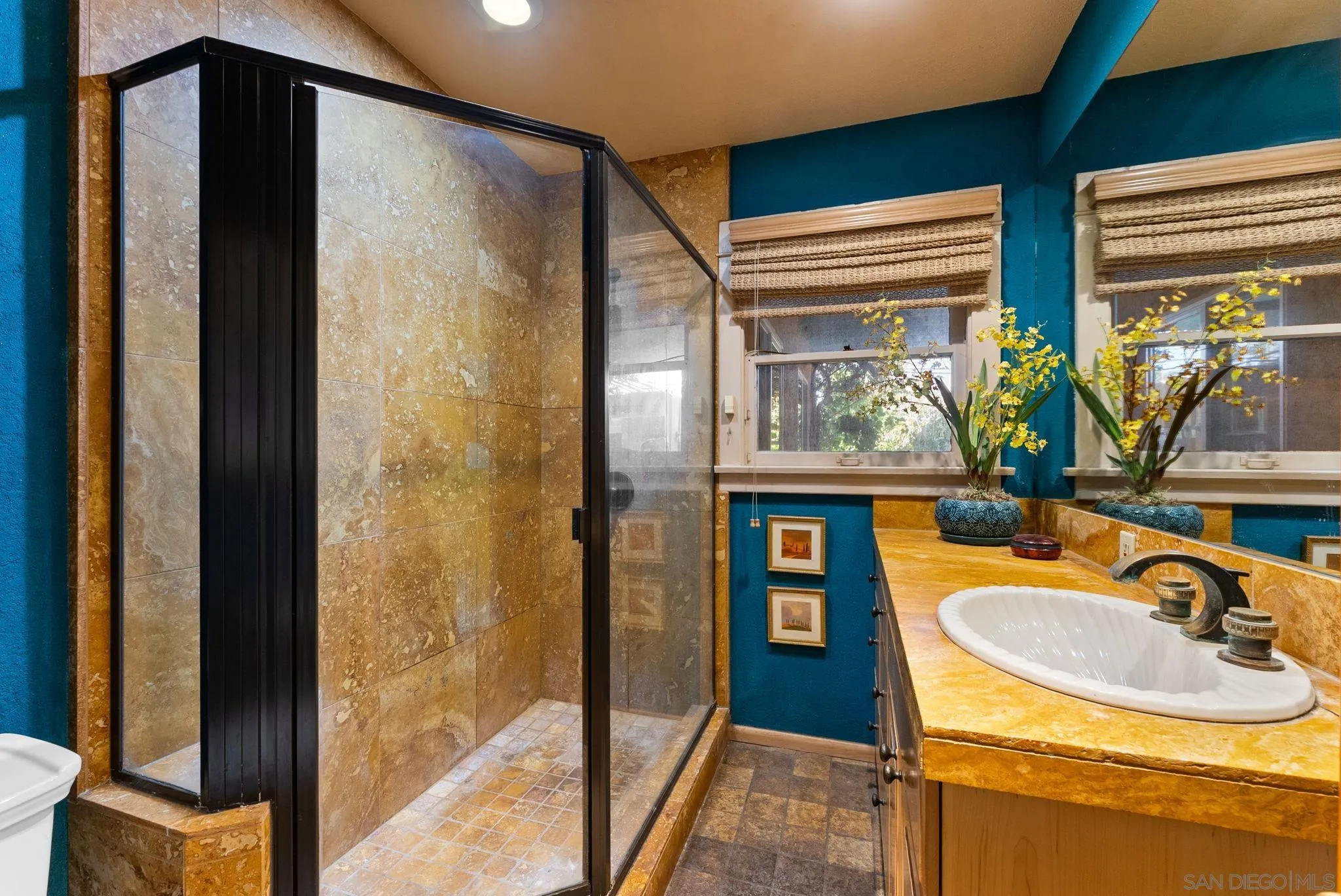 4965 Marlborough Drive San Diego, CA 92116 - Photo 24 of 47 a bathroom with a sink and a mirror