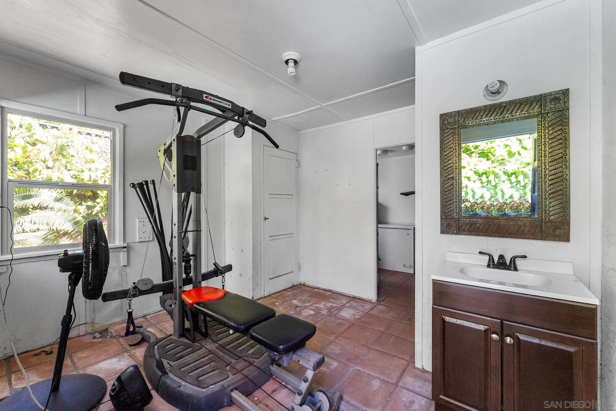 4965 Marlborough Drive San Diego, CA 92116 - Photo 34 of 47 a living room with furniture and a flat screen tv