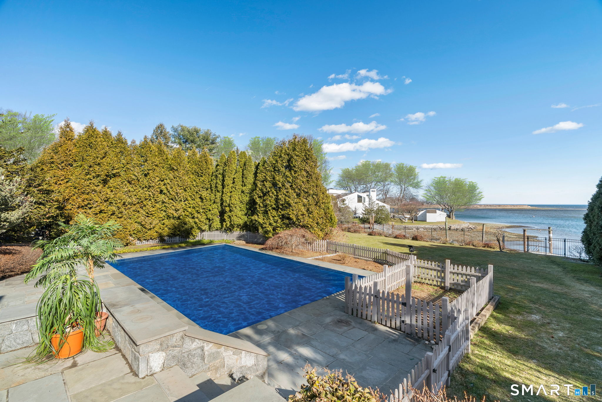 2 Judy Point Lane Westport, CT 06880 - Photo 19 of 27 a view of a swimming pool with a patio