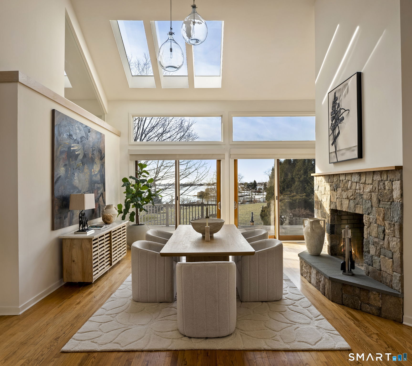 2 Judy Point Lane Westport, CT 06880 - Photo 4 of 27 a living room with furniture a large window and a fireplace
