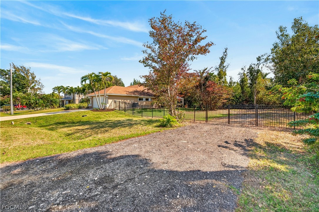 7407 Cobb Road Bokeelia, FL 33922 - Photo 40 of 41 a view of a house with a yard