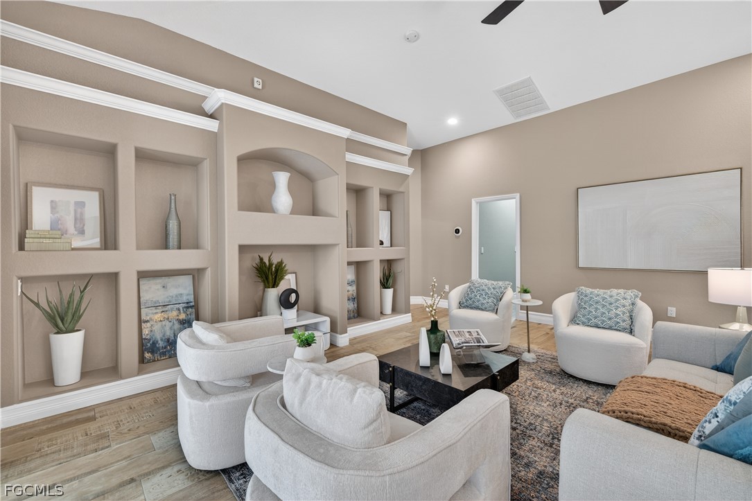 7407 Cobb Road Bokeelia, FL 33922 - Photo 5 of 41 a living room with furniture and a fireplace