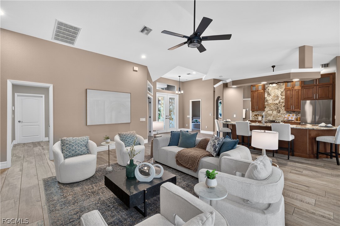 7407 Cobb Road Bokeelia, FL 33922 - Photo 8 of 41 a living room with furniture and a large window