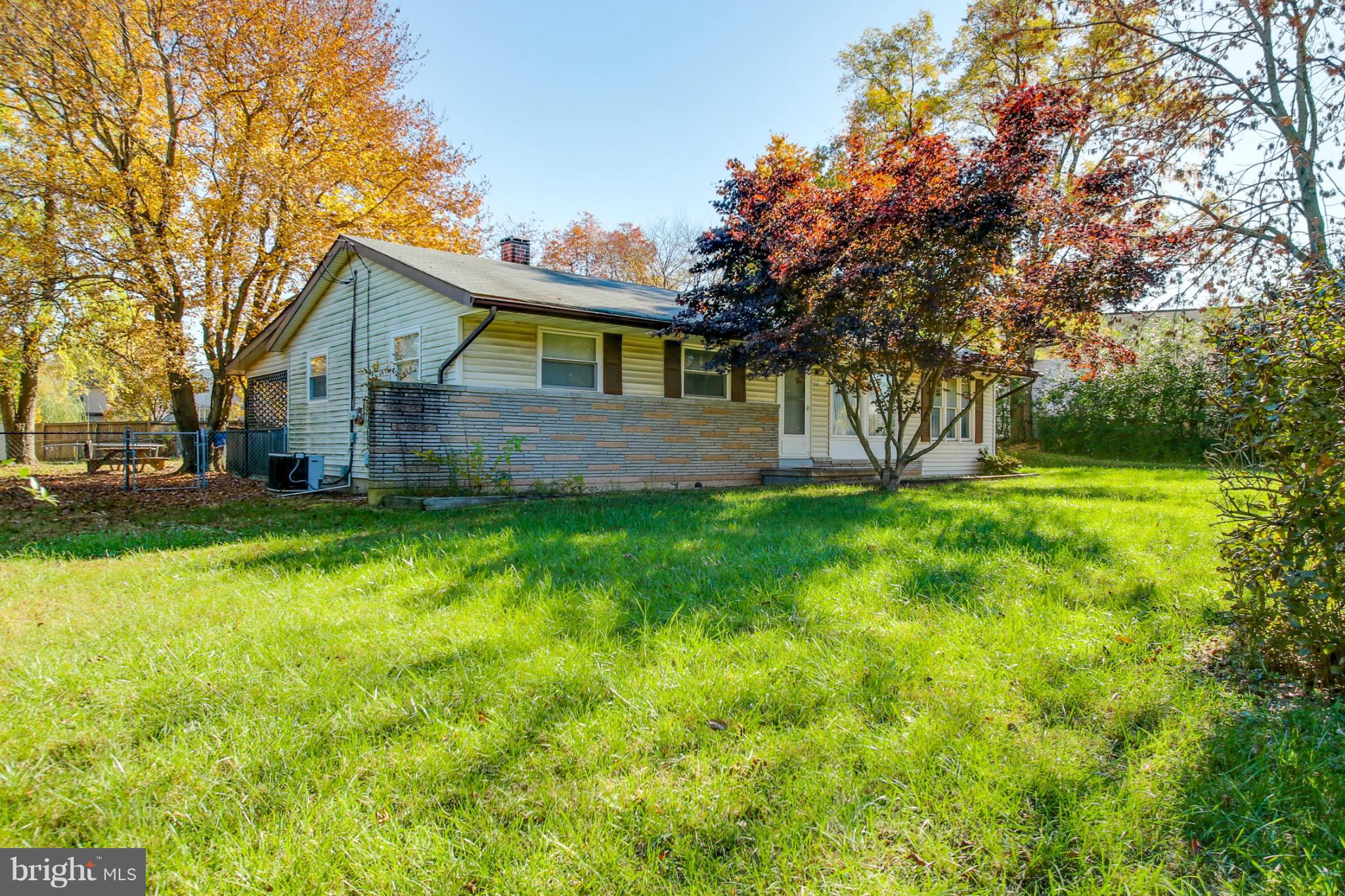 8183 Hog Neck Road Pasadena, MD 21122 - Photo 2 of 29 a view of a house with a big yard