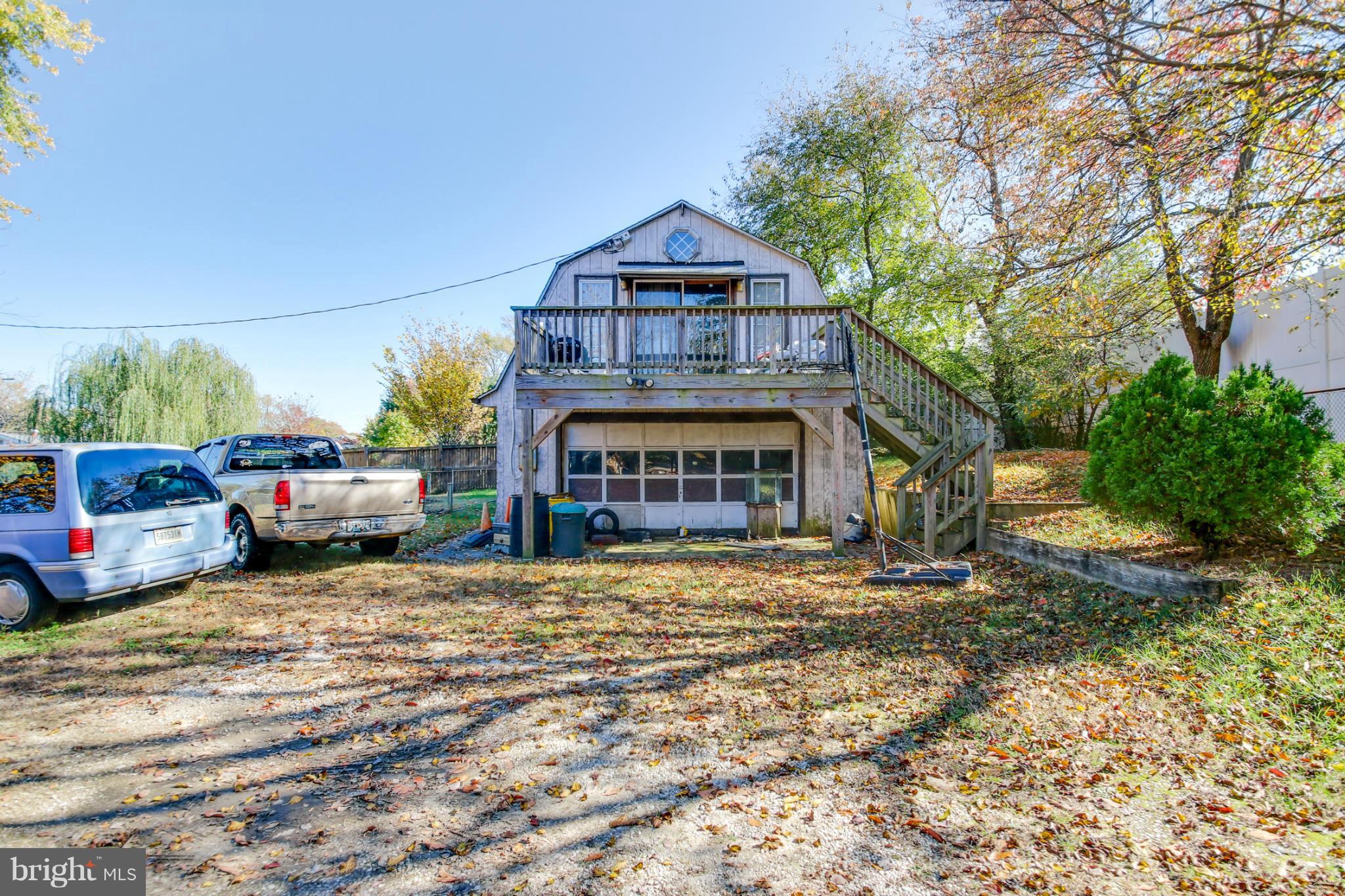 8183 Hog Neck Road Pasadena, MD 21122 - Photo 20 of 29 a front view of a house with a garden