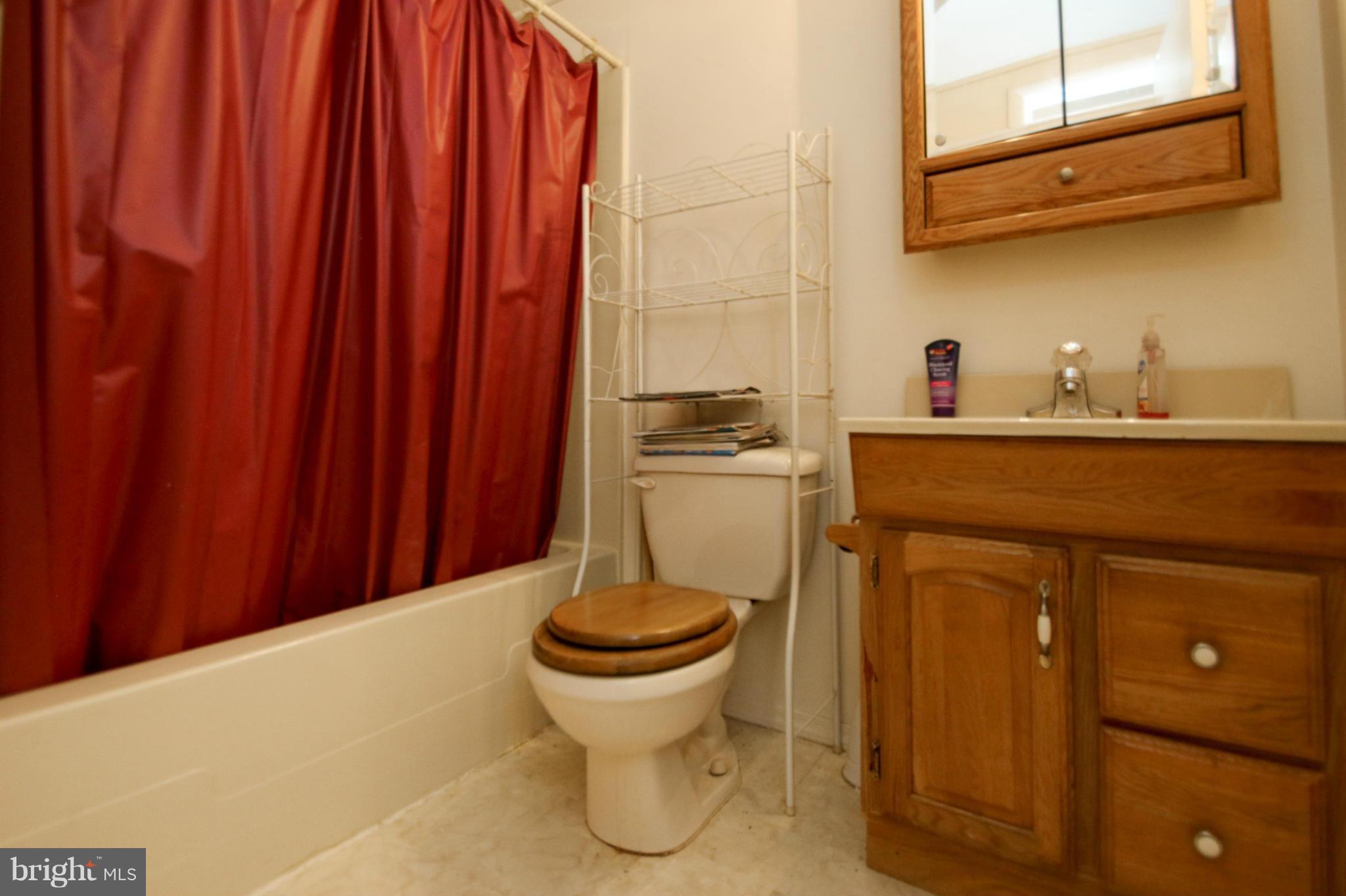8183 Hog Neck Road Pasadena, MD 21122 - Photo 27 of 29 a kitchen with a sink and cabinets