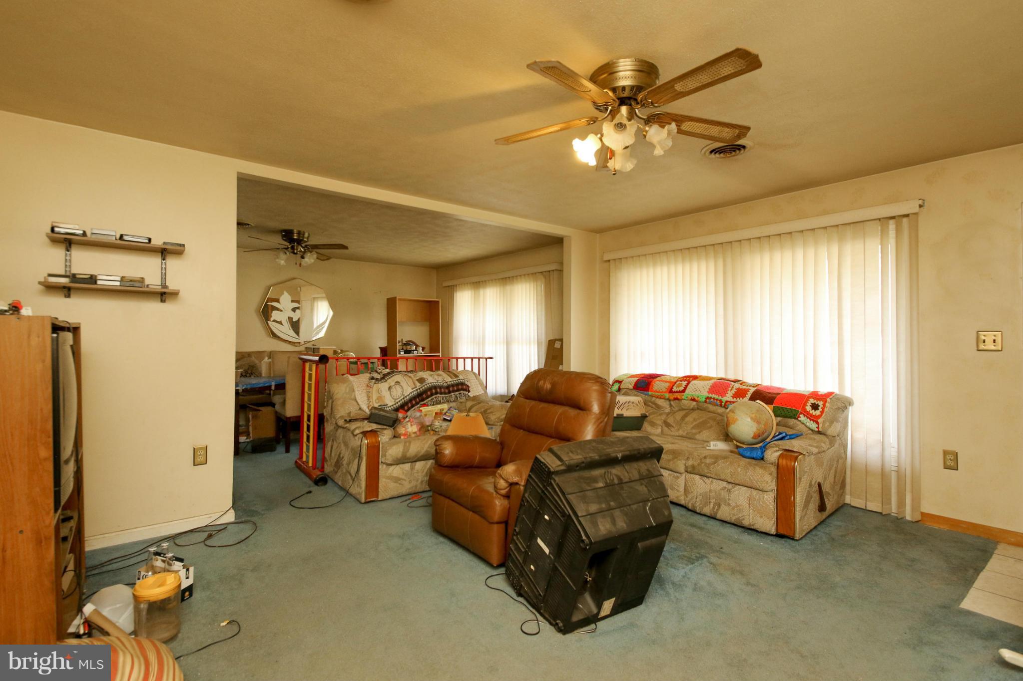8183 Hog Neck Road Pasadena, MD 21122 - Photo 9 of 29 a living room with furniture