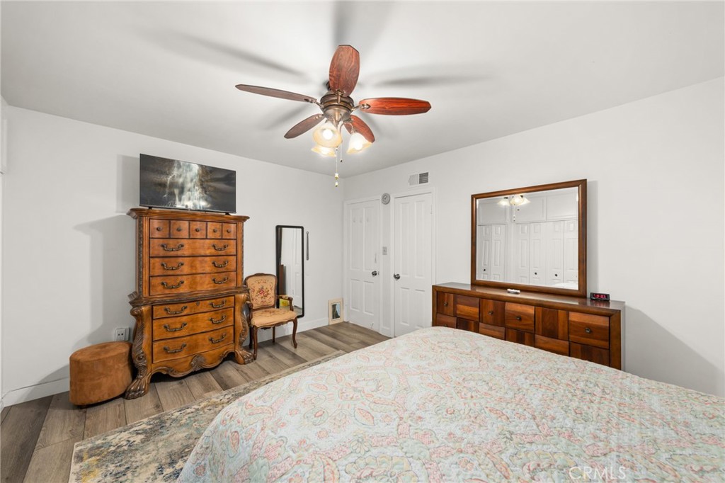 5180 Stonewood Drive Riverside, CA 92506 - Photo 19 of 31 a bedroom with a bed and furniture