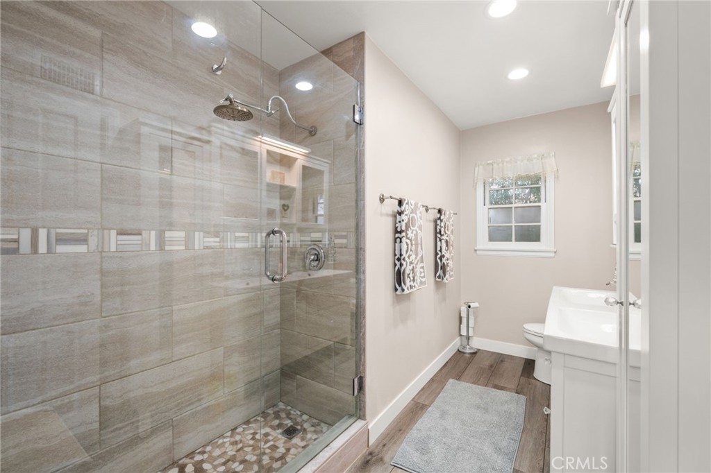 5180 Stonewood Drive Riverside, CA 92506 - Photo 20 of 31 a bathroom with a shower and a toilet
