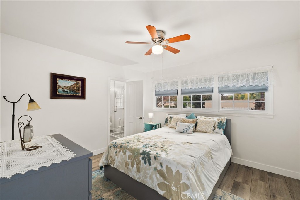 5180 Stonewood Drive Riverside, CA 92506 - Photo 24 of 31 a bedroom with a bed and painting on the wall