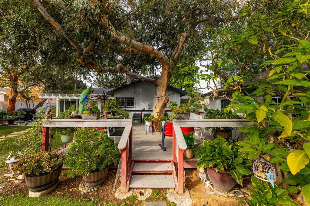5180 Stonewood Drive Riverside, CA 92506 - Photo 27 of 31 a view of house with a yard and potted plants