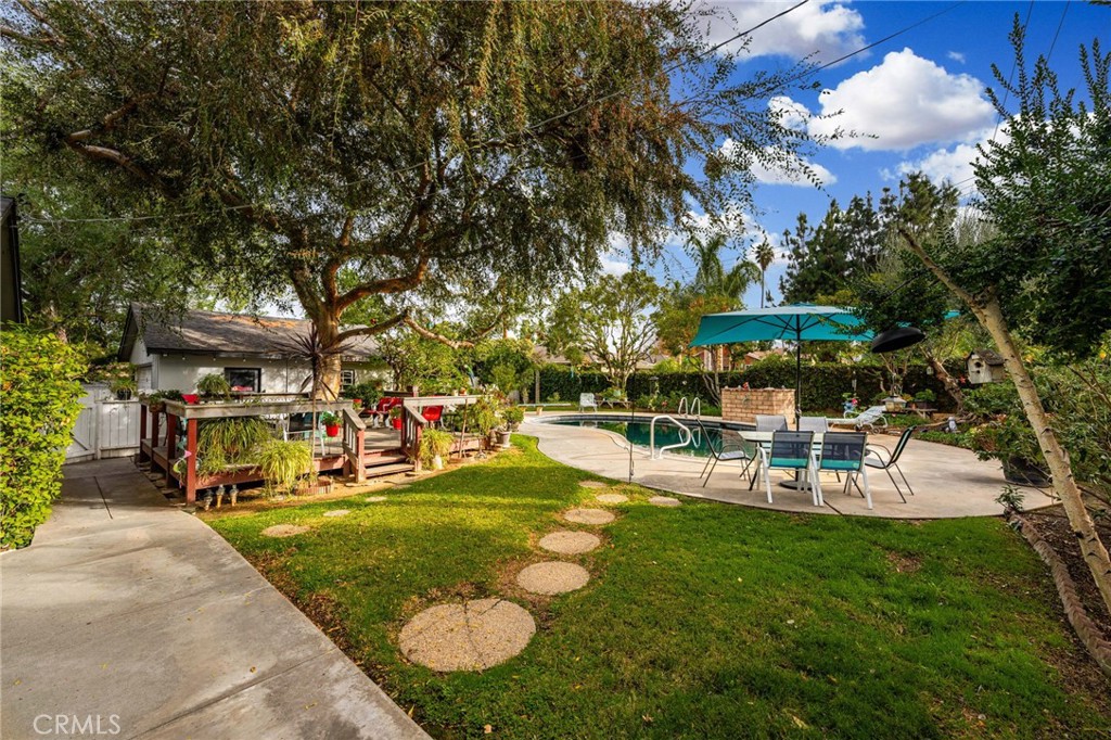 5180 Stonewood Drive Riverside, CA 92506 - Photo 31 of 31 a view of a backyard with swimming pool