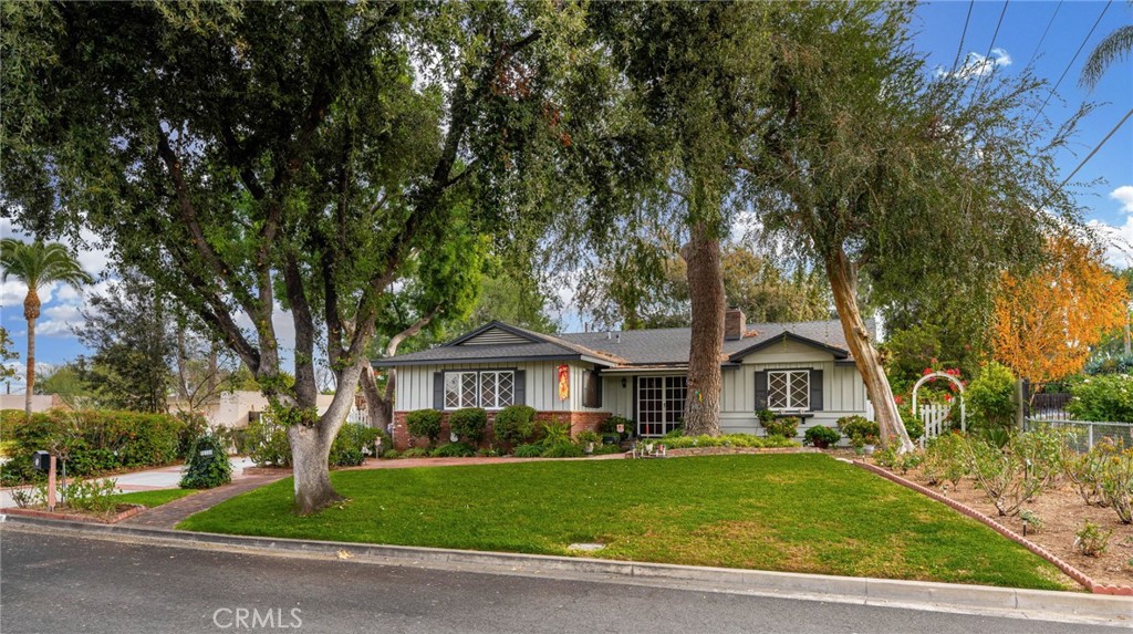 5180 Stonewood Drive Riverside, CA 92506 - Photo 4 of 31 a front view of a house with a yard