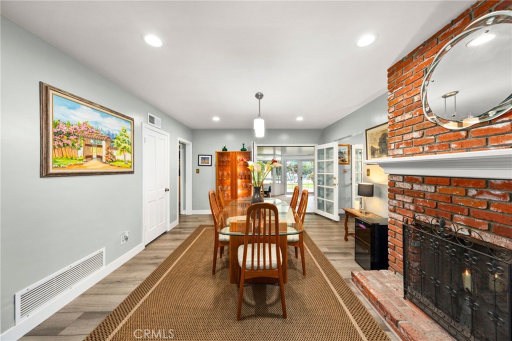 5180 Stonewood Drive Riverside, CA 92506 - Photo 7 of 31 a dining room with furniture and wooden floor