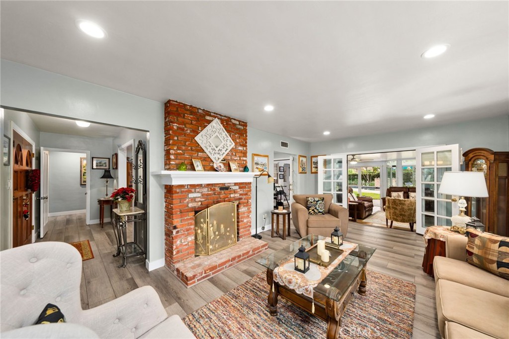 5180 Stonewood Drive Riverside, CA 92506 - Photo 9 of 31 a living room with fireplace furniture and a fireplace
