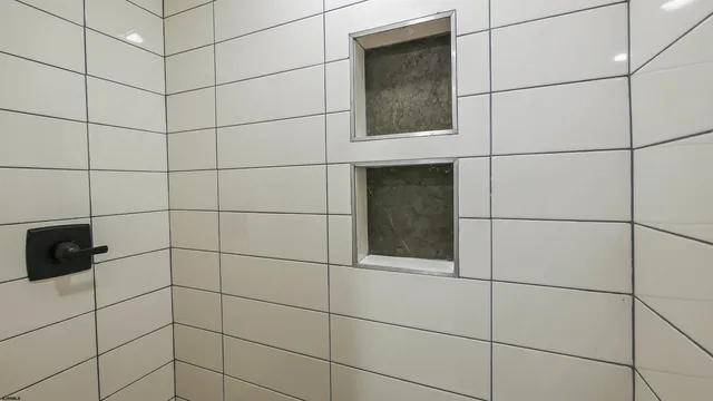 a view of a small space with wooden floor and a window