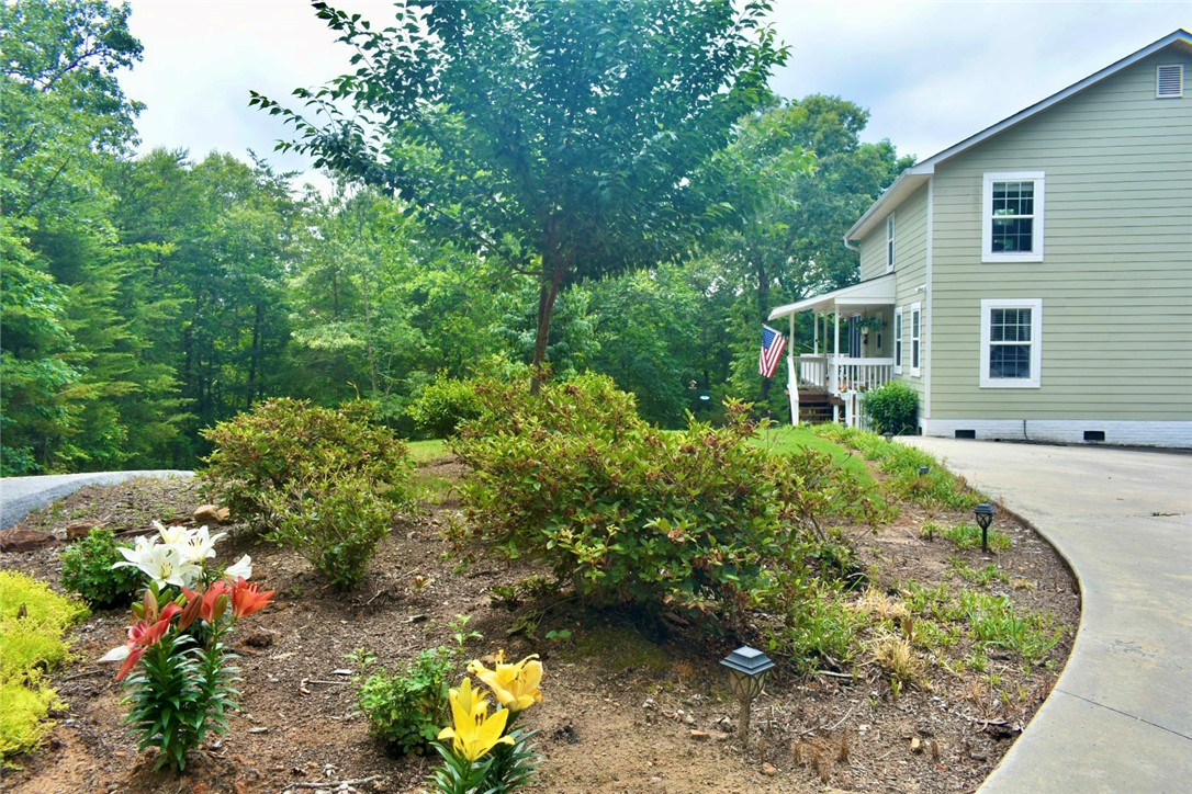 608 McKinney Way Westminster, SC 29693 - Photo 26 of 34 A graceful driveway guides you to this home nestled amongst flourishing landscaping.