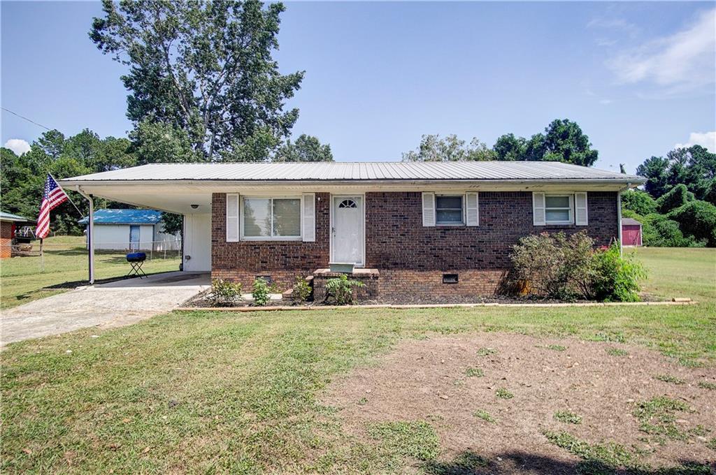 front view of a house with a yard