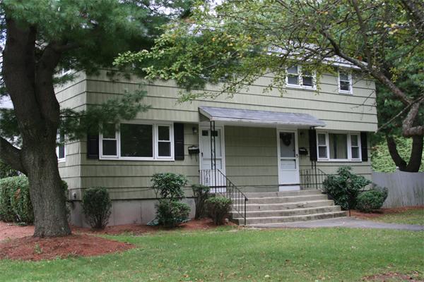 2 Charles Road Winchester, MA 01890 - Photo 1 of 1 a front view of a house with a garden