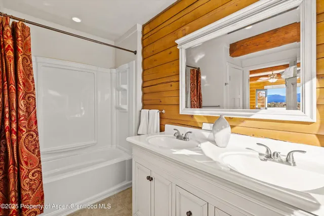 a bedroom with a bed and a lamp