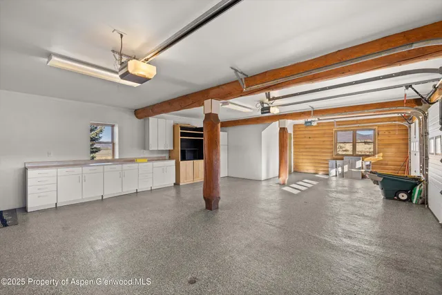 a bathroom with a granite countertop bathtub shower sink and mirror