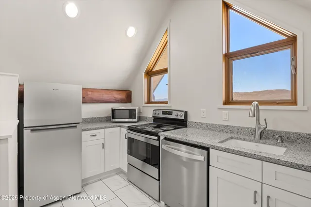 a front view of a house with yard porch and glass door