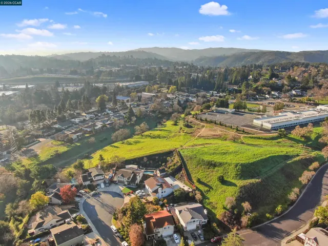 a view of a swimming pool with a lake view and mountain view
