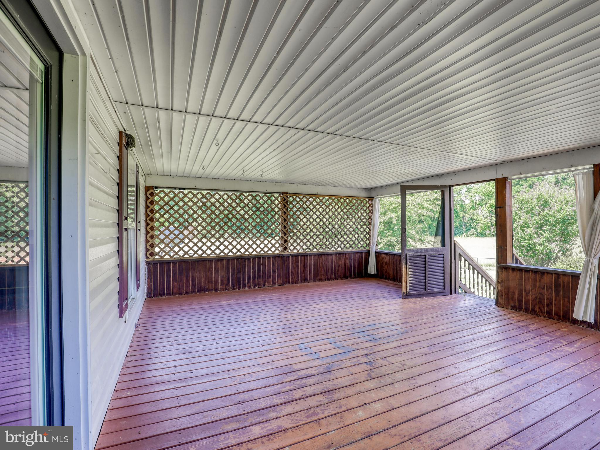 2812 Hunting Ridge Road Winchester, VA 22603 - Photo 26 of 56 Screened porch looking out over 8.37 acres