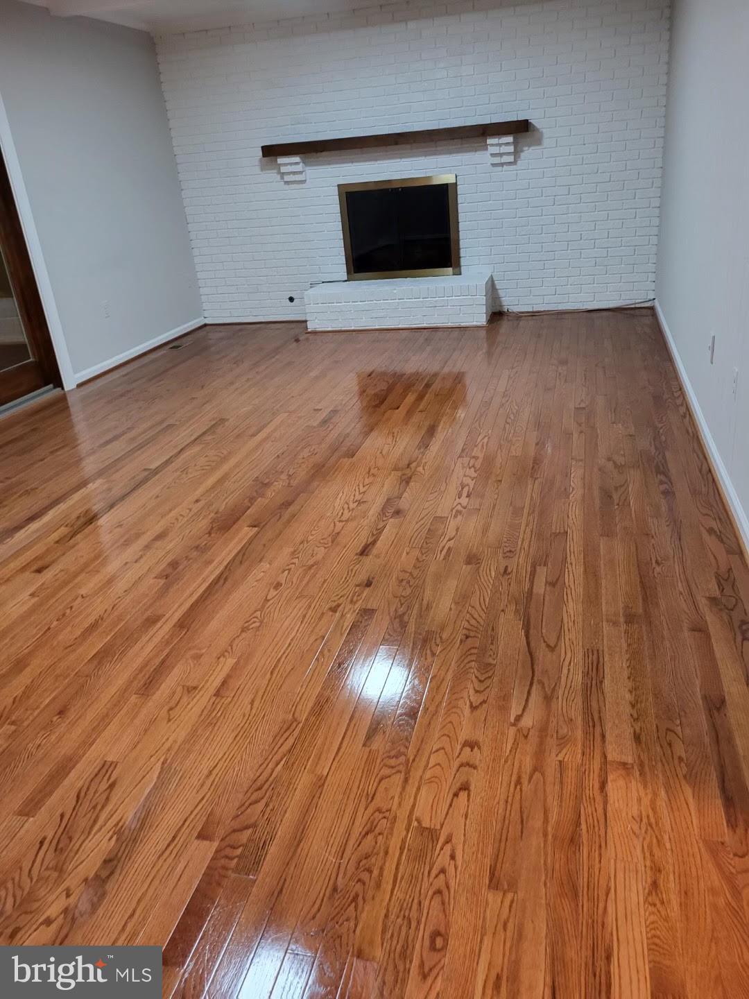 8720 Evangel Drive Springfield, VA 22153 - Photo 58 of 77 Family room with white brick and mantel over fp