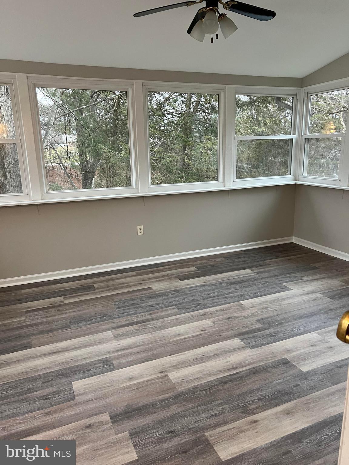 8720 Evangel Drive Springfield, VA 22153 - Photo 60 of 77 Screened in porch with windows and ceiling fan