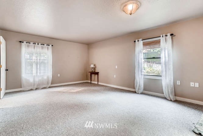 832 Southwest 4th Place Renton, WA 98057 - Photo 13 of 25 a view of an empty room with a window